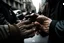 Placeholder: Interlaced hands on a background of city streets. photograph taken with Fuji XT-3 camera and 35 mm lens Real photograph. Photojournalism