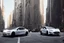 Placeholder: A Tesla 'Model S' is parked, on 'Wall Street', in New York. (CINEMATIC, WIDE ANGLE LENS, PHOTO REAL)