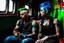 Placeholder: Un pareja punk, con crestas de colores azules y verdes beben unas latas de color rojo de Coca Cola, sentados en el vagón de tren abandonado y destartalado