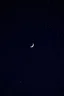 Placeholder: A dark night sky in blue, with white speckled stars and a crescent moon outlined in black