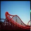 Placeholder: kodachrome of a roller coaster, evening light, ralaxing