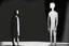 Placeholder: monochrome, cardboard figure on the left of the picture, stocky human figure with a head tilted to the left, almost no neck, no face or hair, schematic drawing, against a dark grey background with a symmetrical pattern, a lighter grey, almost monochrome, in moonlight, crayon drawing in shades of grey and black, ethereal, cinematic postprocessing