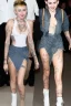 Placeholder: neck tattoo, nude, long avantgarde hair, tit - free denim dress, 16 y.o. Miley Cyrus walkinh with nude Emma Watson , tattoos, open white jacket, medium long eighties hair