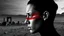 Placeholder: black and white portrait, a human face in profile, gaze into nothingness, three red engraved stripes on the face, alone, pain, background behind it a surreal, barren landscape, ruins, and a black sun. dark, thriller, gloomy vibe, utopian, dramatic