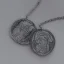 Placeholder: pendant in a form of two conjoined silver coins, watercolor, large strokes, illustration, fantasy