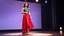 Placeholder: very beautiful 1 lady with makeup curvy hair pretty long red skirt and bluose with nice jewel patterns high heels, full body standing gracefully in modern stage,dynamic lights