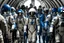 Placeholder: A group of humans with spacesuit walking out of a spaceship in front of a crowd