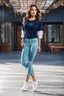 Placeholder: full body of very beautiful girl gean pants and blouse , curvy hair ,standing idle happy pose in studio pretty makeup,perfect face,sport shoes