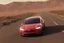 Placeholder: A Tesla 'Model S' is racing at top speed, in Mos Eisley on the planet Tatooine. (CINEMATIC, WIDE ANGLE LENS, PHOTO REAL)
