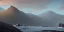 Placeholder: Cold desolate, mountainous, snowy, misty, dark, barren land by the seaside