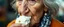 Placeholder: close up portrait of the sweetest soulfull magical old woman with no makeup eating ice cream with her nose