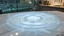 Placeholder: modern labraratory instrument environment, water waves created Cymatics pretty patterns that sound waves make on water in luxury lab in a big pot on the table sync with music ferquency t