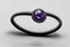 Placeholder: небольшое чёрное кольцо с приделанным лиловым камнем