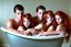 Placeholder: digital art of beautiful young auburn hair teenage girls with dad in the bedroom in a bathtub with grandpa hugging bare lips