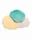 Placeholder: powder on a white background painted with watercolor paints, top view