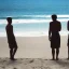 Placeholder: three men waiting for their friend to come back to join them on the beach