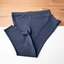 Placeholder: Folded sportlegging, top view, flat lay.