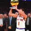 Placeholder: Jalen Brunson winning the NBA finals with the new york Knicks at Madison Square Garden and holding the MVP trophy above his head