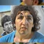 Placeholder: Create a highly realistic 3D scene. An detailed Realistic of Play Football Diego Maradona transforming her into a woman with the same specifications as the attached image. The method of transforming the painting in full detail. A comedic and funny touch. Ultra wide angle. Extremely realistic fine details. Highly realistic detailed display. Great full presentation and amazing drawing style. Transfer the full detailed drawing of the image at a wide and precise angle. Inspiri