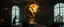 Placeholder: Lotsa goths trying to contain energy from floating glowing vessel made by twisted snakelike sticks creating weird geometric form in dramatic scene in luxury parlour in the style of Giger and Escher