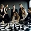 Placeholder: A chess game with female fashion models as the chess pieces.