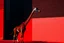 Placeholder: a painting of a giraffe standing in front of a building with red and black, a raytraced image, video art, digital horse, projection mapping, colorkey scene, still from a music video, mirrors edge art style, red and cinematic lighting, animated cinematography, volumetric lighting. red