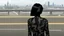 Placeholder: Tall thin woman, with straight black hair, dressed in a camouflaged jumpsuit, looking out from the rear of a futuristic aircar, on a tarmac runway, with a city skyline in the distance