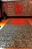 Placeholder: A light rosy orange colored Karoo with moles designed in Moroccan rug art painted by Keith Haring