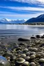 Placeholder: hace mucho frío, aguas cristalinas, se ven caracoles y ostras en la orilla del mar, a lo lejos vegetación y montañas nevadas