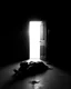 Placeholder: In a dark room, light streams in through an open door symbolizing new possibilities, hope, and overcoming problems.a man is laying down dead , a man is standing looking at him