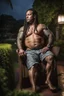 Placeholder: half figure shot photography of a heavyset gipsy shirtless man, 35 years old in bulging shorts, tattoo, manly chest, short dreadlocks , sweat, wet, relaxing on a chair, in a private elegant garden of a villa, raining nighttime, big shoulders, big tights, ambient occlusion, photorealistic, frontal view from the ground, dim light from little bulbs