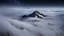 Placeholder: looking down from space at a misty mountain coming through the mist and surrounded by the mist at night starry sky