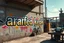 Placeholder: there is an arafed sign that says "arafed képek!" on the wall of a building, rolands zilvinskis 3d render art, dystopian grunge, steampunk grafitti, hyper realistic digital art, sticker art, disco elysium style, pexels, neoexpressionist, gritty background, solarpunk, oilpunk, unsplash transparent, to be or not to be, scrap metal on workbenches, infinite regression, interconnected human lifeforms, by Hans Bol, symbolic mural, a cd album cover art by Kurt Roesch, graffiti, disco elysium character