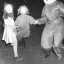 Placeholder: Creepy old photo of rainbow zippy monster chasing children at new year