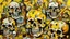 Placeholder: Abstract, expressionist painting featuring a still life with skulls. The layout is chaotic and vibrant, with three prominent skulls in the center, each with distinct facial features and hollow eye sockets. The skulls are painted in shades of yellow and brown, with dark, bold outlines. Surrounding the skulls are various objects, including a playing card with an ace of spades, a bottle, and a banana, all rendered in a similarly bold and exaggerated style. The background is a mix of orange, red, an