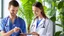 Placeholder: male and female doctor with stethoscope examining bunch of herbal plants and smiling