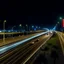 Placeholder: Cars on the highway at night with beautiful lighting and clear sky