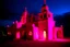 Placeholder: A pink light glowing monastery designed in Kuna molas painted by Lyonel Charles Feininger