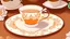 Placeholder: Cartoon Victorian fantasy orange tea with white petals on a brown table with a white lace table cloth