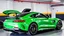 Placeholder: Mercedes-Benz AMG GT63s, green, with four side doors parked in a luxury garage, with the car facing right