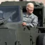 Placeholder:  Joe Biden driving a military Vehicle