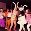 Placeholder: 1980s photo of new year's party monkey with dancing cats