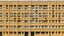 Placeholder: Una fachada modular compuesta por compartimentos repetidos, cada uno con una ventana cuadrada y un panel liso, color ocre uniforme que unifica toda la superficie, perspectiva exactamente frontal que convierte el patrón en ritmo abstracto, ausencia de contexto urbano, atmósfera de maqueta conceptual y orden extremo