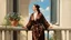 Placeholder: woman in bath robe on the balcony painted by Caravaggio