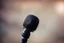 Placeholder: picture of a microphone; blurry background