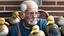 Placeholder: confused older man using cellphone on his porch attacked by many ducks