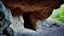 Placeholder: cave in the mountain rock face