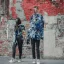 Placeholder: photo of a couple wearing high fashion clothes, balenciaga, Photorealistic photography, colorful, high contrast, future city, street, fashion photography, high resolution, 8k, moody, hard light, gen z, wide angle lens