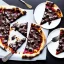 Placeholder: pizza with chocolate, black table