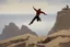 Placeholder: man jumping from the cliff by phil hale